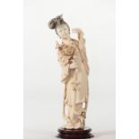 China sculpture of a young woman with an inlay flower