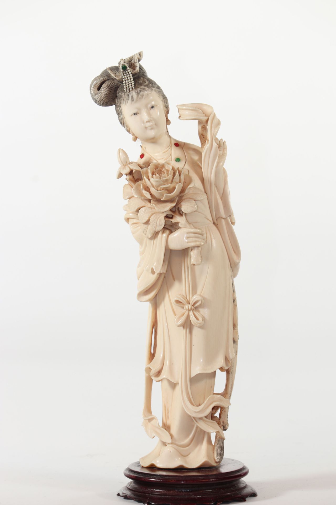 China sculpture of a young woman with an inlay flower