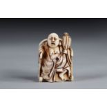 Netsuke carved - a Buddha seated on a throne. Japan Meiji period late 19th signature