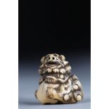 Netsuke carved - a ShiShi on a ball. Japan Edo period