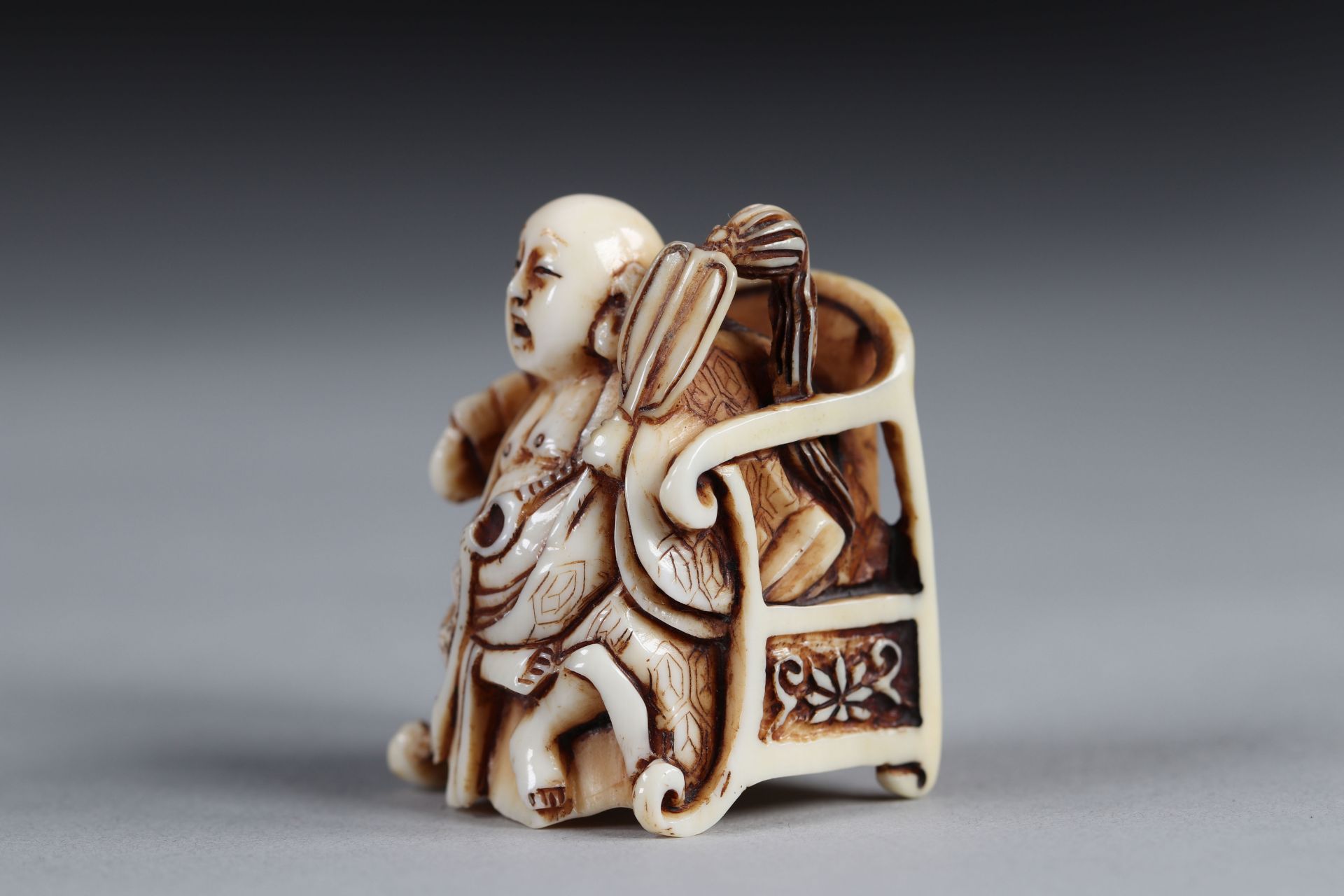 Netsuke carved - a Buddha seated on a throne. Japan Meiji period late 19th signature - Image 4 of 5