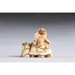 Netsuke carved - figures riding a turtle. Japan Meiji 19th century