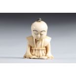 Netsuke carved - a seated figure. Japan Meiji 19th century