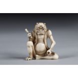 Netsuke carved - a seated Oni. Japan d"bu 20th