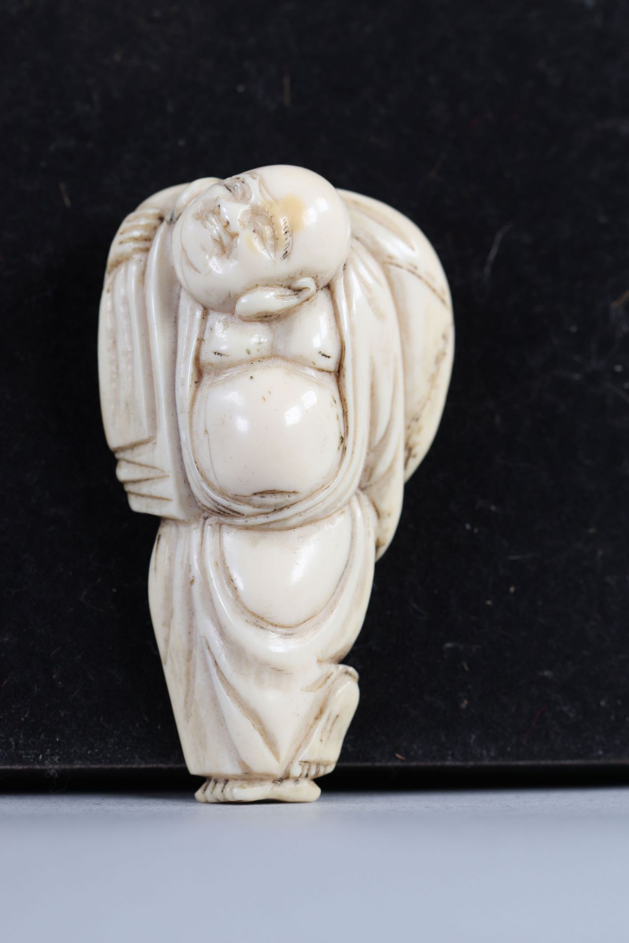 Netsuke carved - a Buddha. Japan Meiji period around 1900