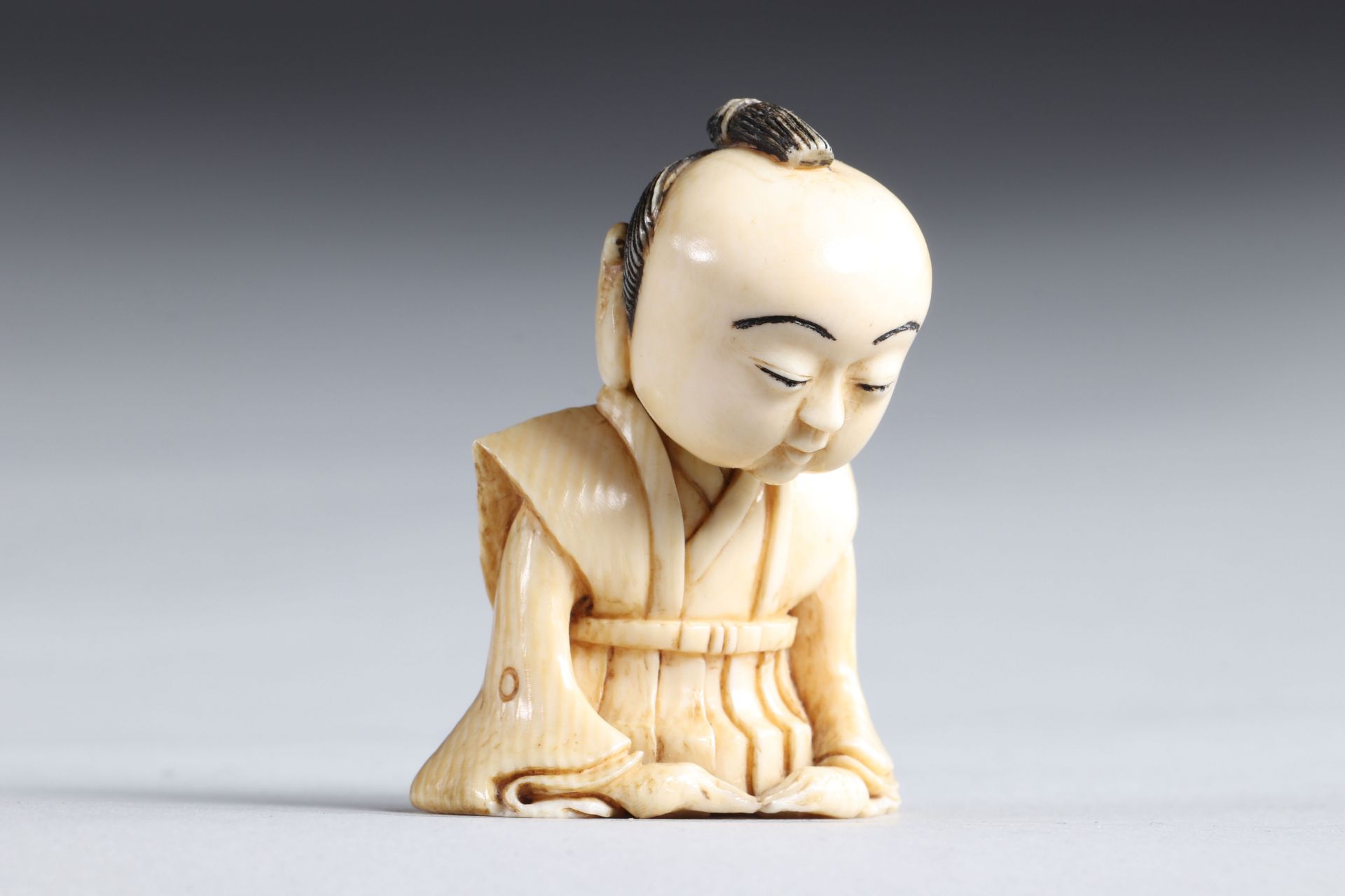 Netsuke carved - a seated figure. Japan Meiji 19th century - Image 2 of 4