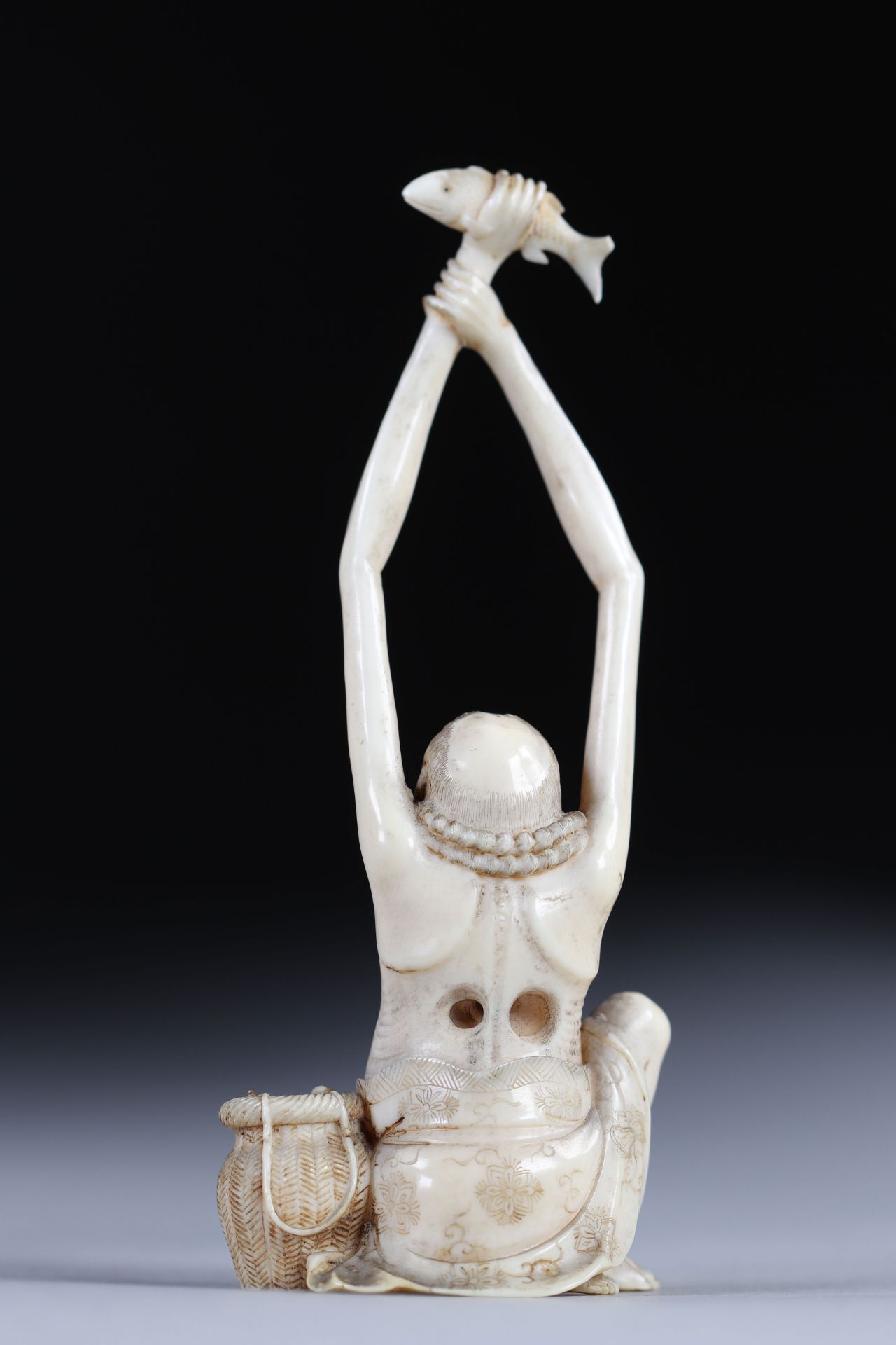 Netsuke carved - a cartoonish long-arm fisherman. Japan Meiji period late 19th - Image 2 of 3