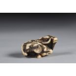 Netsuke carved - a lying buffalo. Japan Meiji period late 19th signature