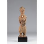Statue Agni-Old female statue Agni (Ivory Coast). Dressed in a shirt and loincloth, the object is co