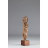 Lobi statuette-Very old Lobi statuette. Harmonious face with the mouth masked by the hand. Earthy pa