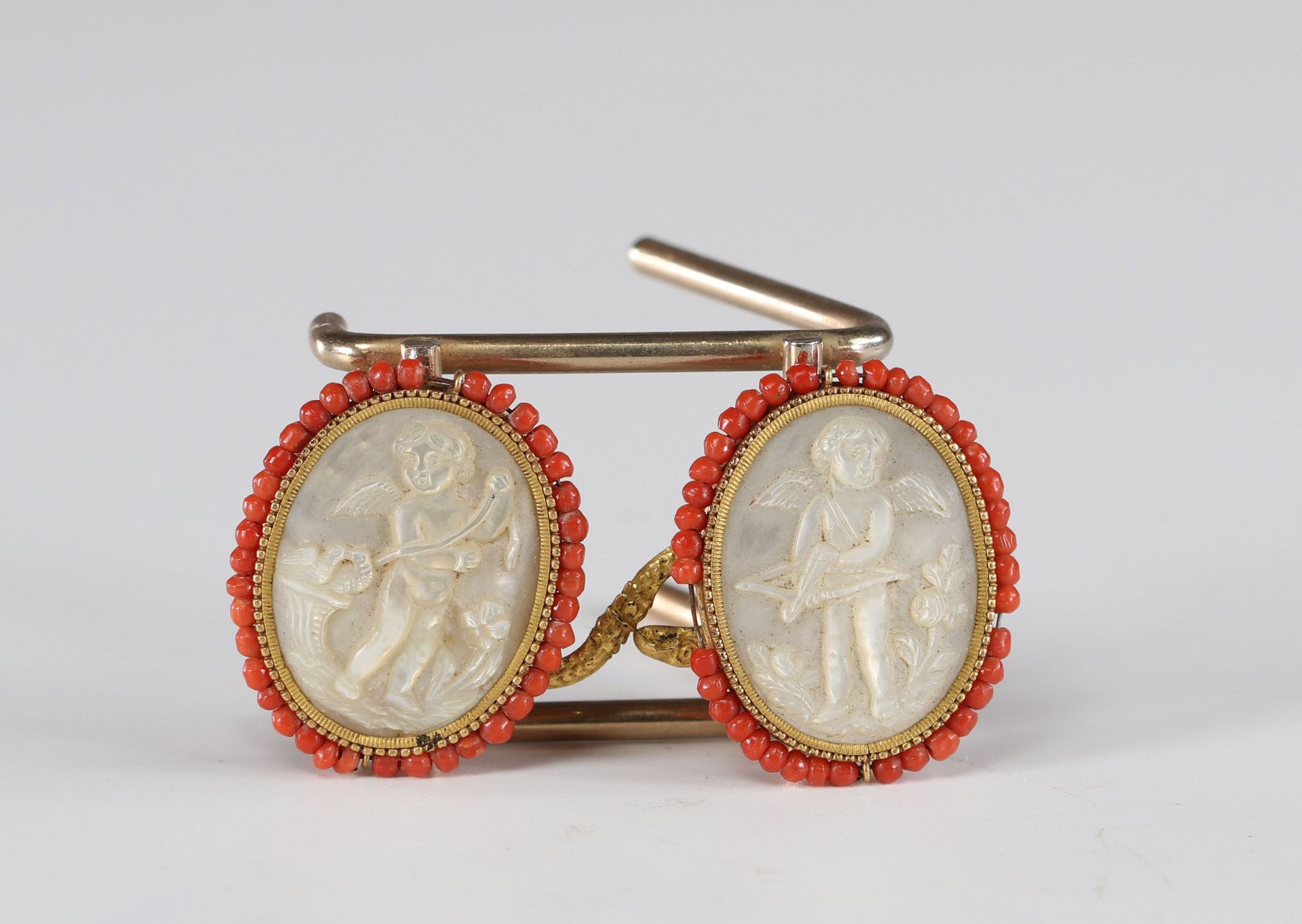 Rare Louis XV mother-of-pearl and coral buttons "engraved with cherubs".