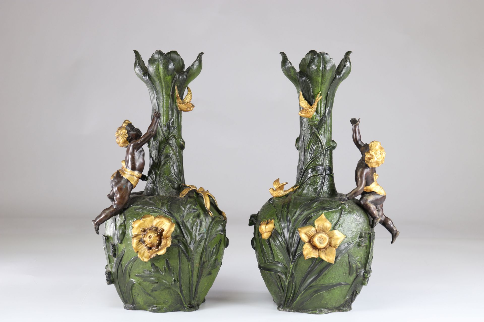 Pair of Art Nouveau vases with floral decoration and cherubs