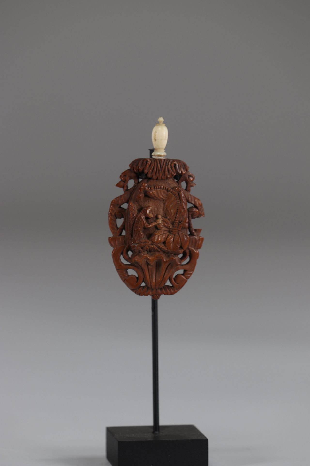 19th century sculpted corozo voice bottle