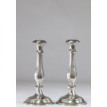 Pair of silver candlesticks with floral decoration