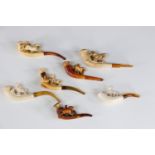 Lot of 7 amber and foam pipes decorated with horses