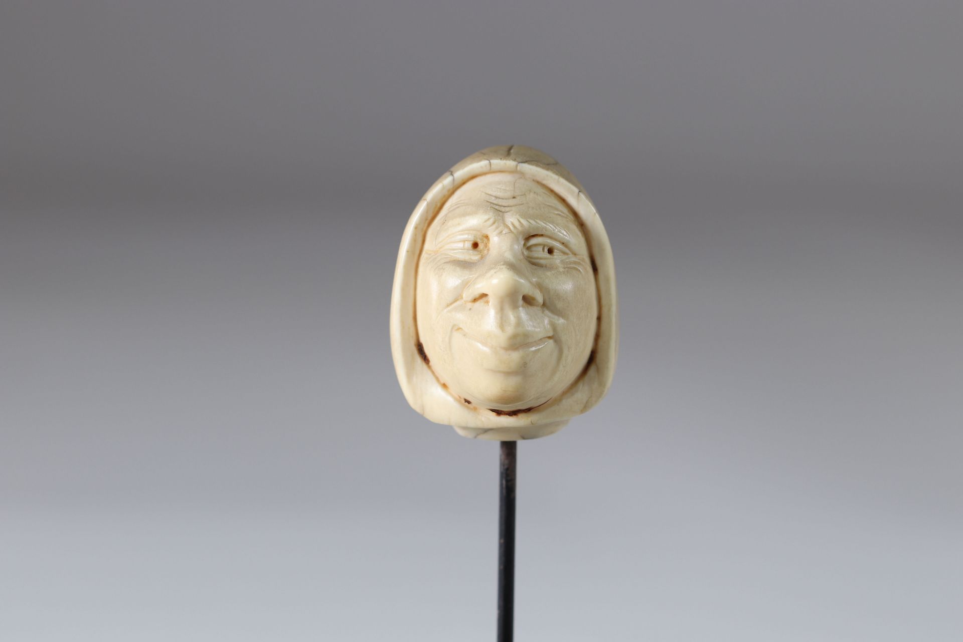 Cane knob carved with a monk's head