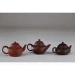 Chinese teapots (set of 3) In Terracotta Yixing marks under the pieces
