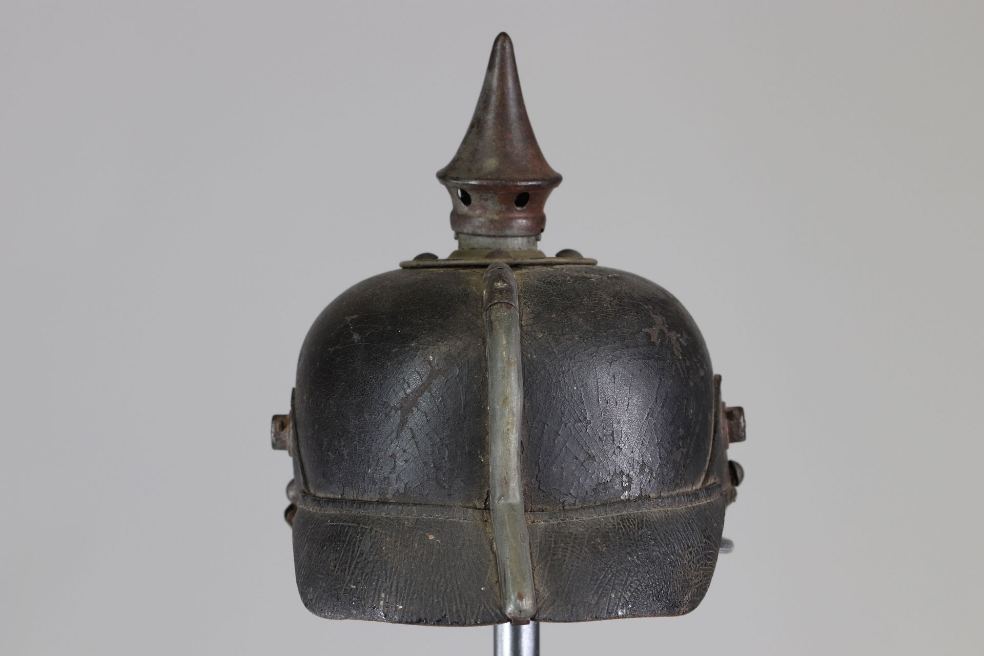 Small gray tip helmet with unit stamp + one year