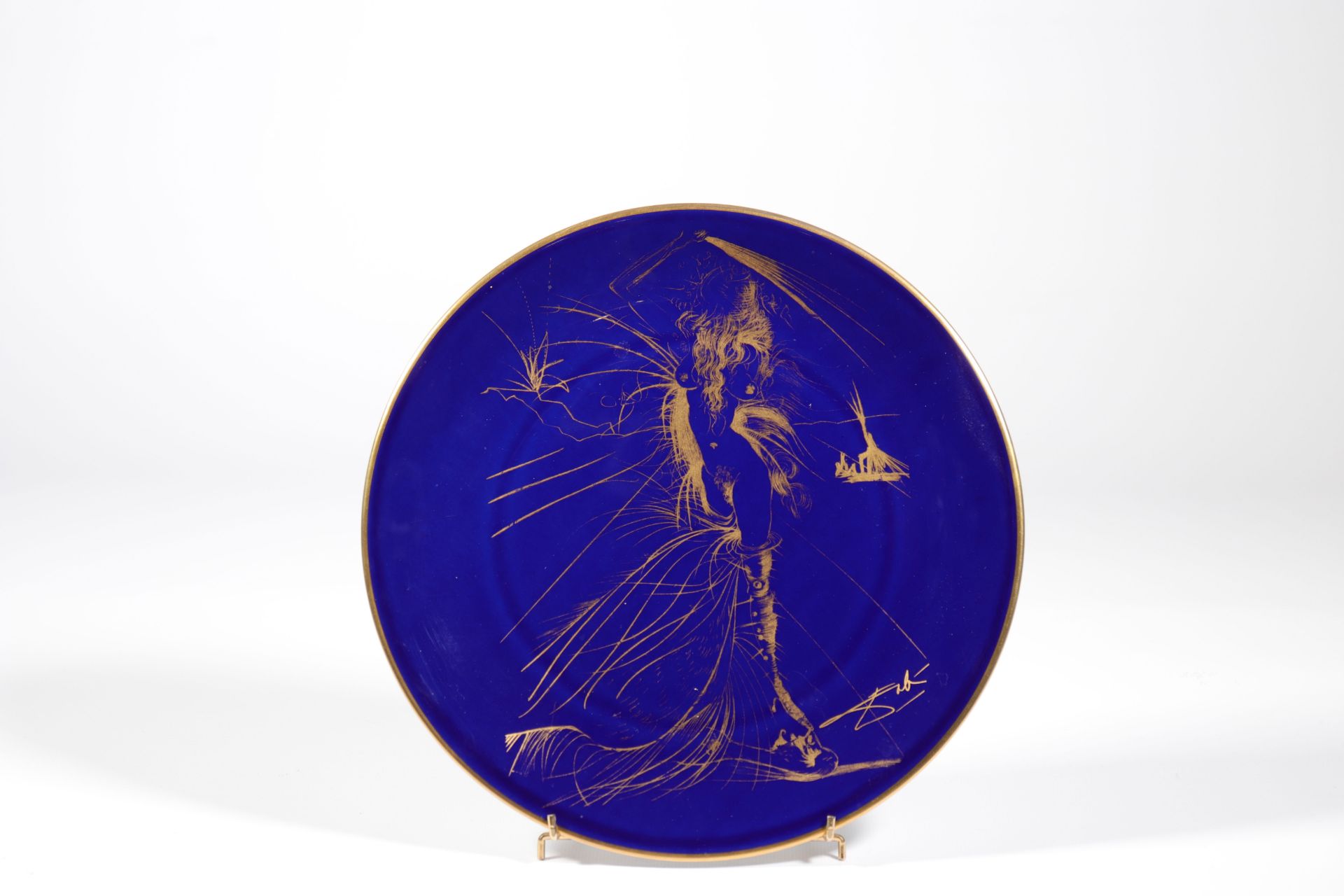 Salvador Dali. "Venus fur". 1967. Limoges oven blue and gold plate. Signed "Dali" on the front in gi