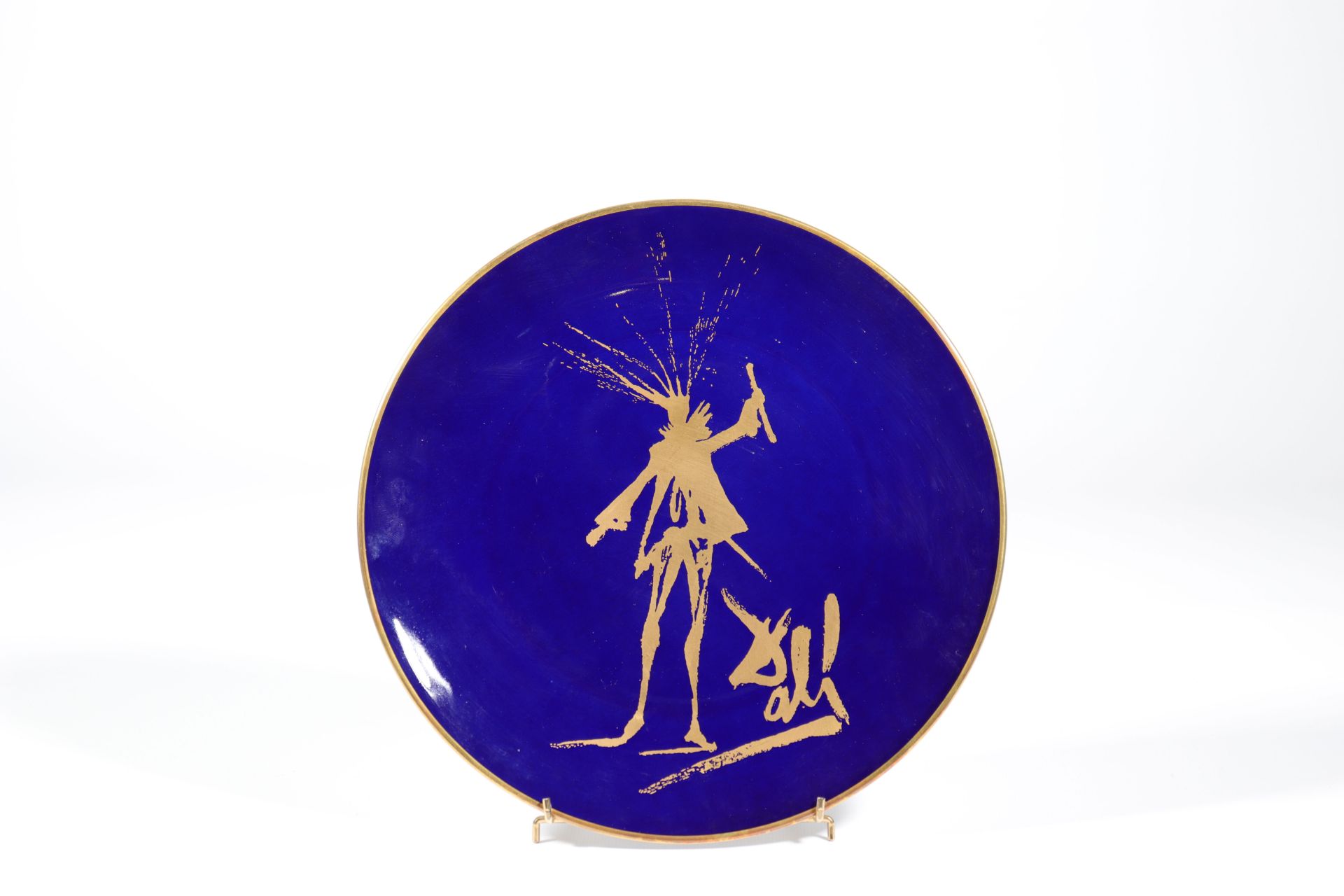 Salvador Dali. “The silhouette of Faust”. 1968. Limoges oven blue and gold plate. Signed "Dali" on t