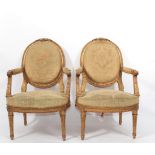 Pair of Louis XVI period armchairs in carved and gilded wood with 18th leaf