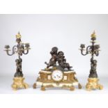 Pendulum cherub and bronze candelabra garniture with two patinas