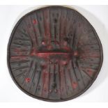 Rare imposing circular shield in black leather with embossed radiating patterns. Ethiopia.