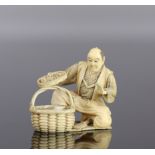 Japan Finely carved okimono of a man discovering a 19th century carp