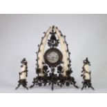 Colonial clock, in wrought iron and carved tusks circa 1920