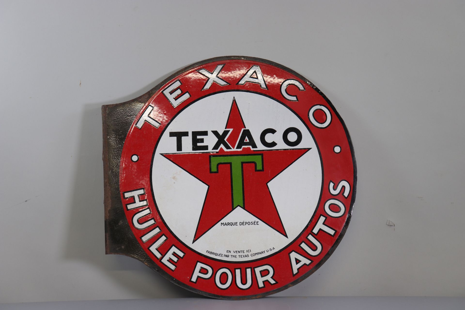 Double-sided Texaco circular sign