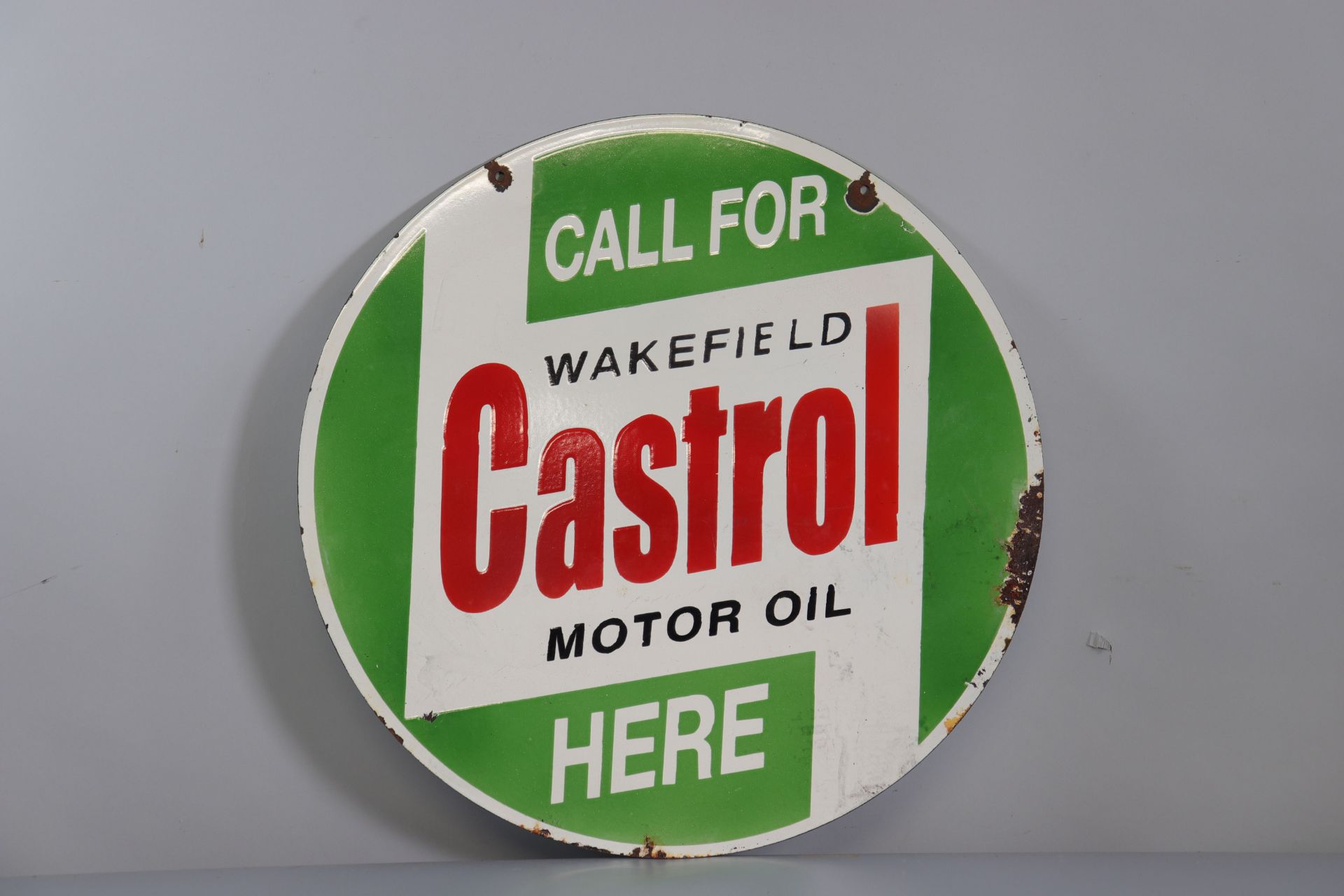 Double-sided Castrol circular enamel sign