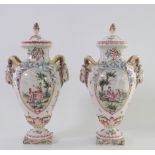 France pair of earthenware vases with handle decorated with a goat's head