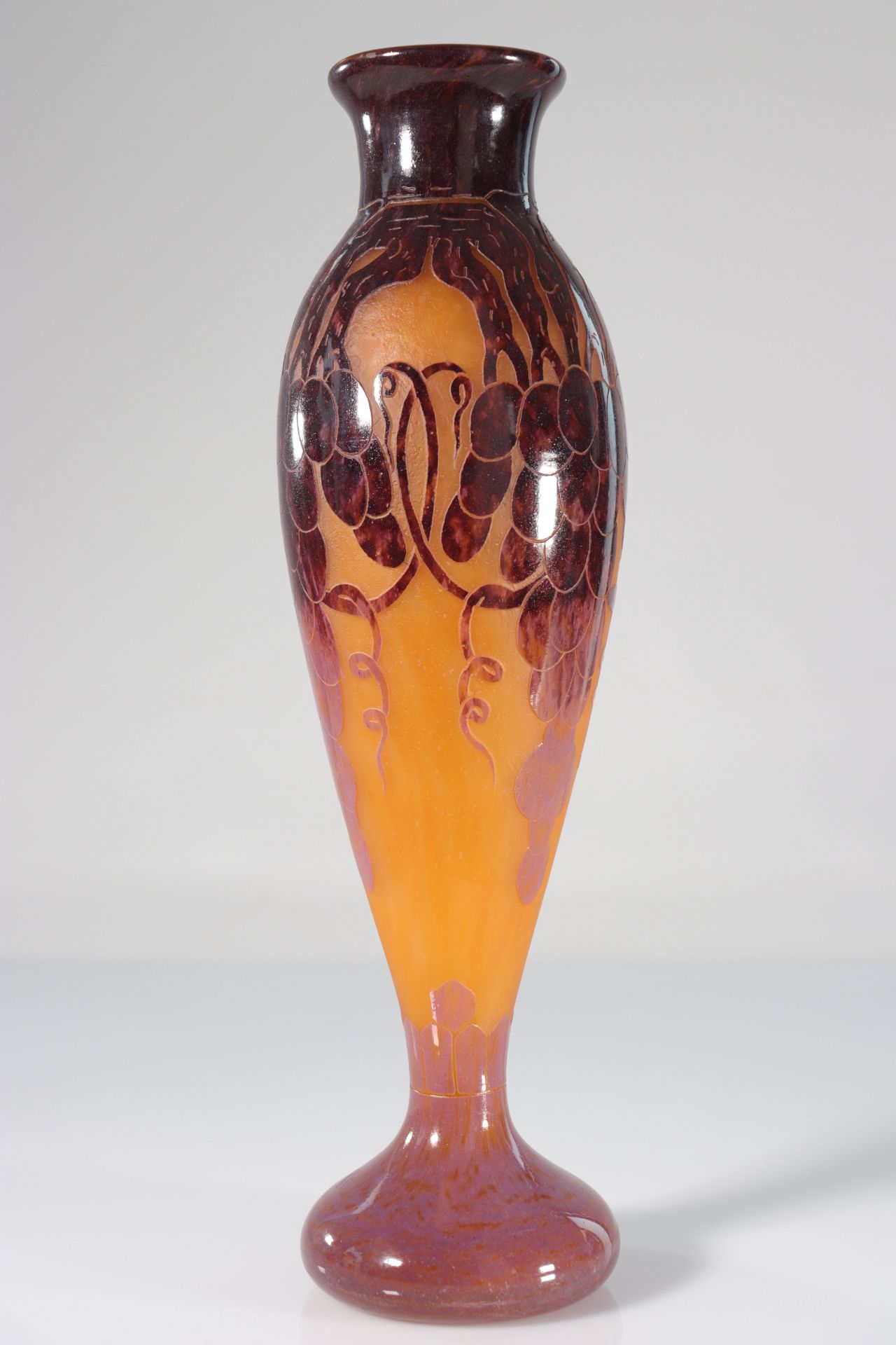 The imposing French glass vase with grape decoration