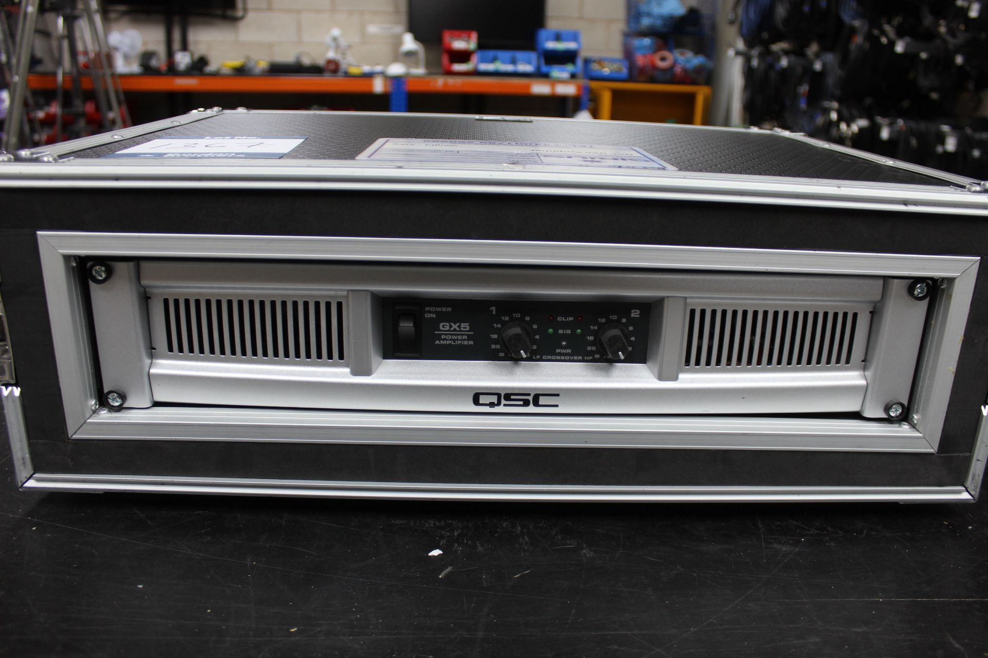 QSC GX5 amplifier, Serial No. 111626478 with 1x IEC in flight case (Purchased in 2018 for £297).