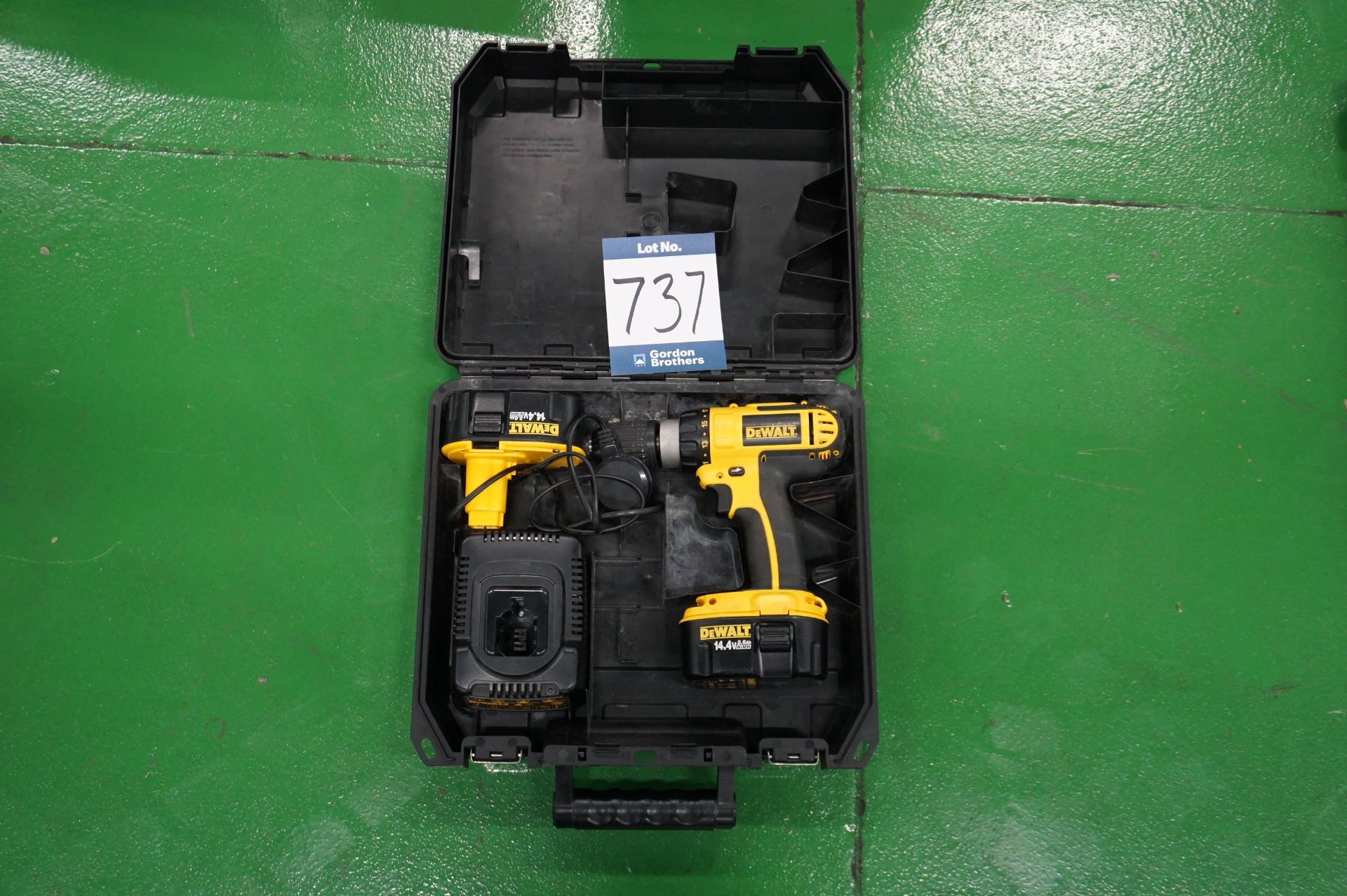 Dewalt unknown model cordless hand drill with charging dock, spare battery and carry case