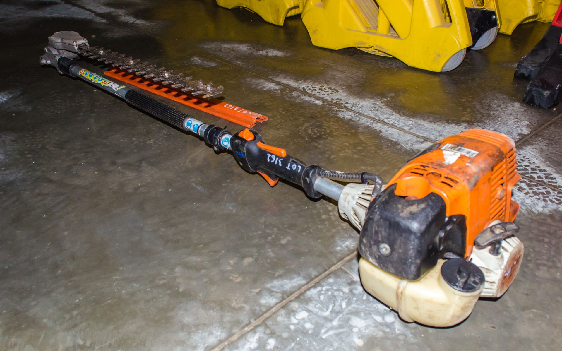 Stihl petrol driven long reach hedge cutter