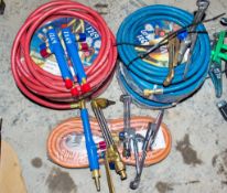 A quantity of gas welding/ cutting torches & hoses as photographed