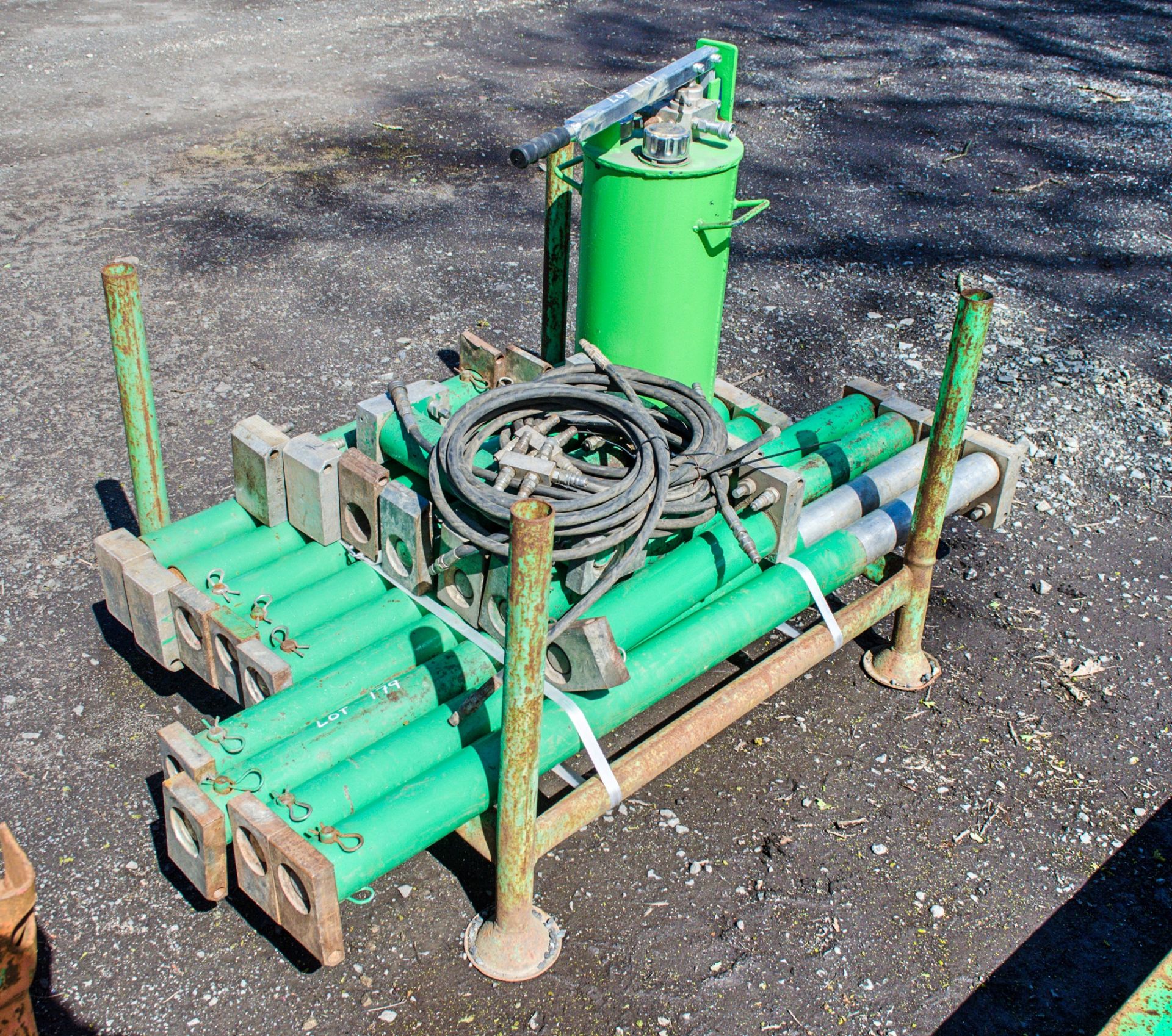 Stillage of 16 hydraulic trench box connectors & pump