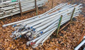 Stillage of miscellaneous aluminium scaffold tower poles as photographed