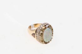 Opal-Brillantring750 er Gelbgold. Ovaler Opal 3,13 ct., mit Fancy Diamanten 2,33 ct. Gesamtgew.: