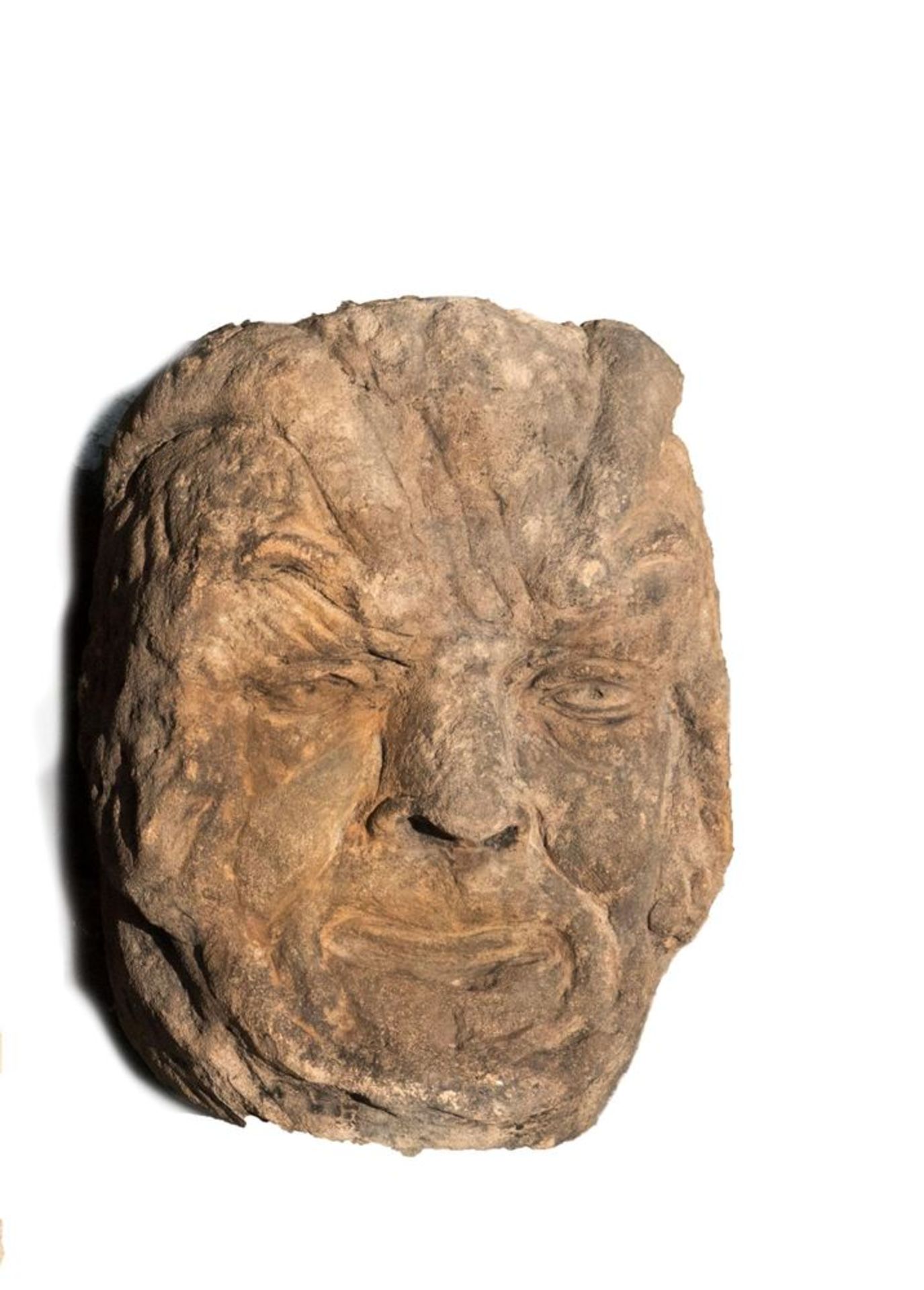 Kopf eines Fauns 16/17. Jh.Sandstein gehauen. 30 x 21 cm.