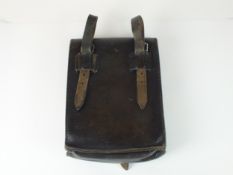 A German M35 black leather map/dispatch case, dated 1942, with twin map compartments and