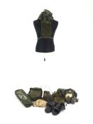 Collection including backstraps, pouches, overshoes and mosquito net