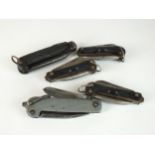 Four military pocket knives and one further pocket knife