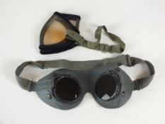 A pair of German WW2 tropical dust goggles together with a pair of German WW2 grey leather