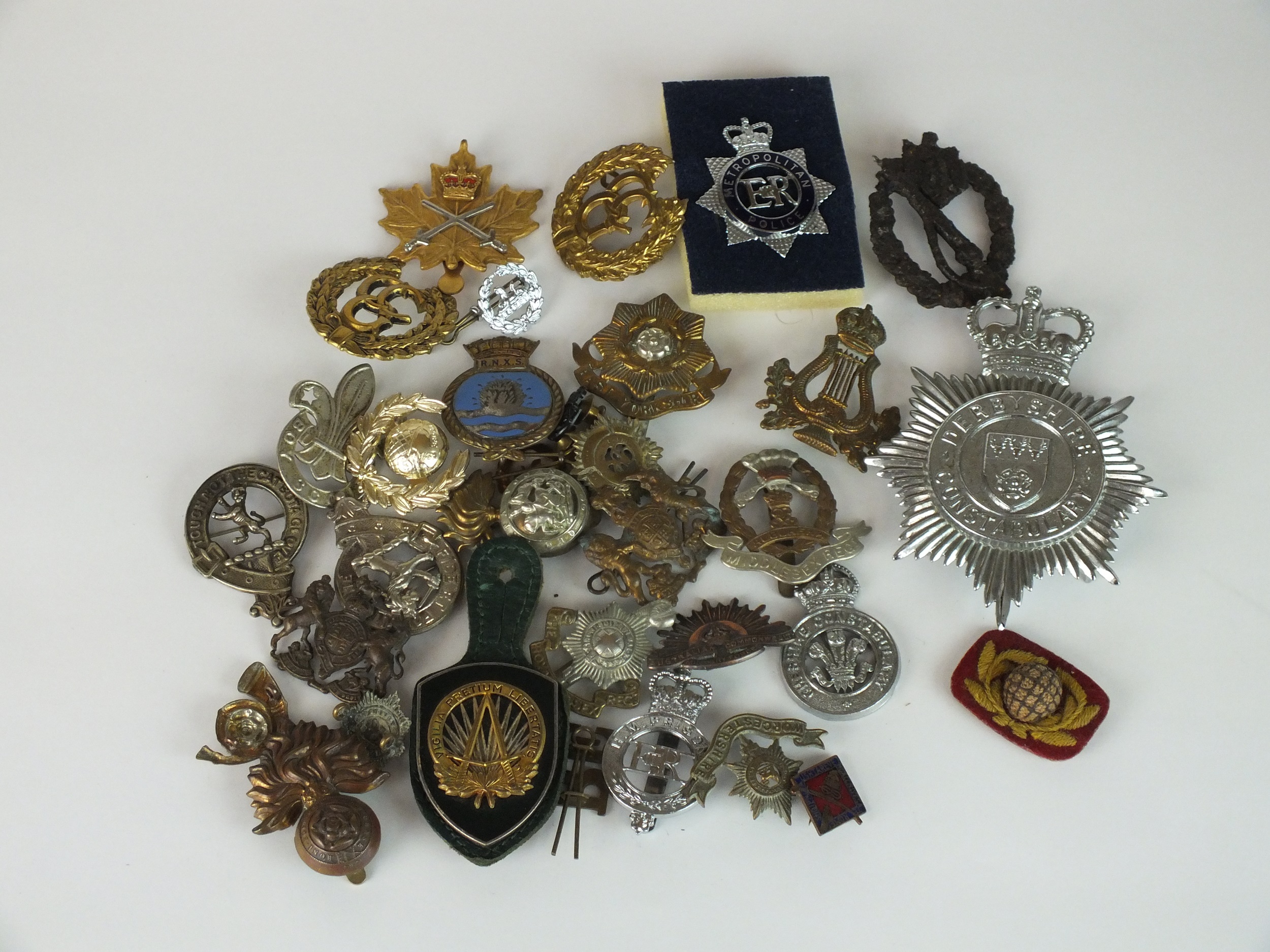 A collection of 30 assorted army, police, Scottish clan, boy scout, a relic WW2 German badge etc