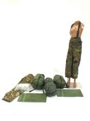 A collection including three military sleeping bags, military hand towels, numerous pairs of