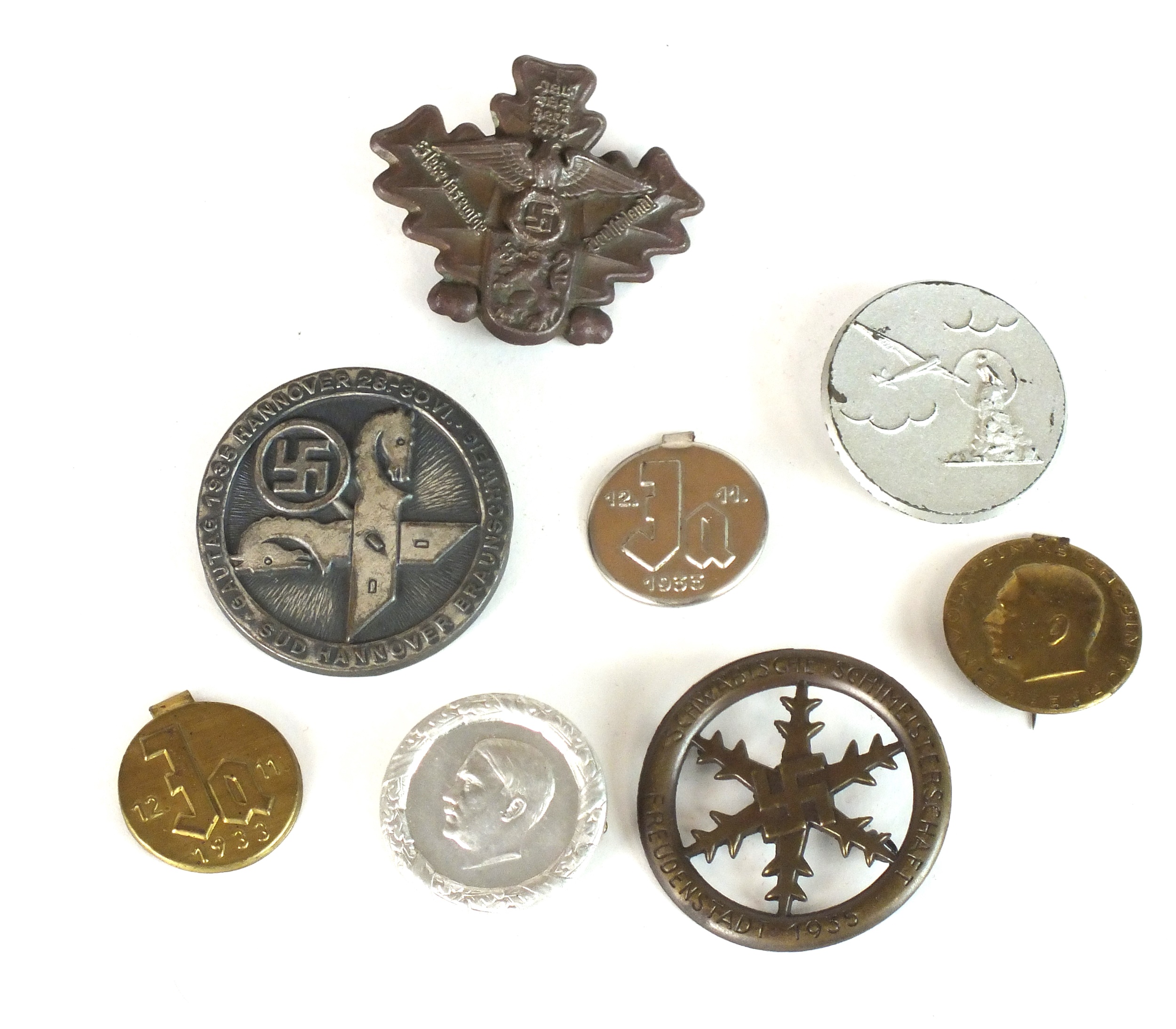 A collection of German Third Reich tinnies and badges