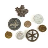 A collection of German Third Reich tinnies and badges