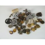 Quantity of military badges, collar studs and buttons
